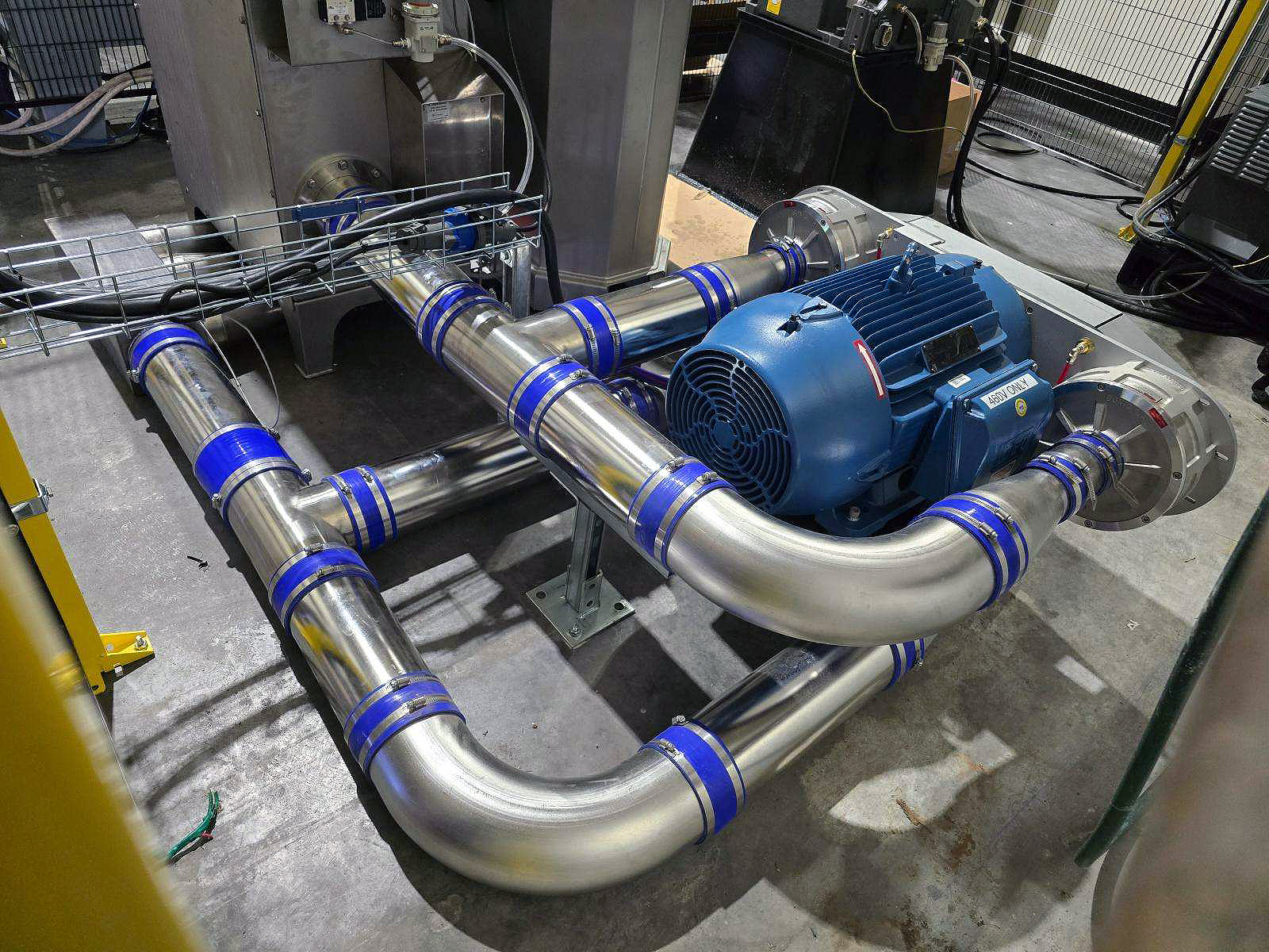 Industrial blue motor and stainless-steel piping assembly for custom air systems