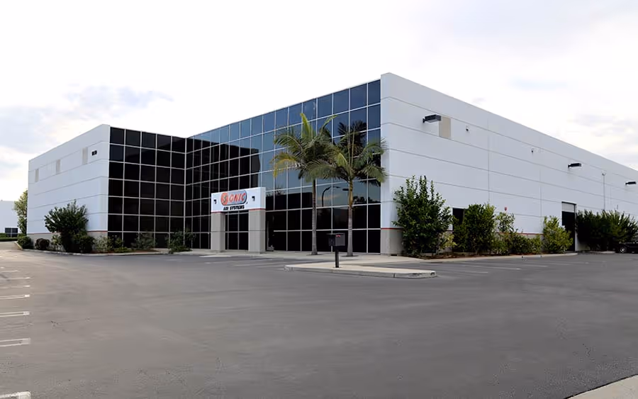 Sonic Air Systems headquarters in Brea, California, with its glass-fronted office and industrial facility.