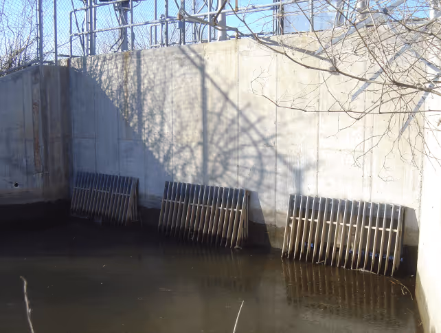 Industrial sluice gate in a water-filled concrete basin