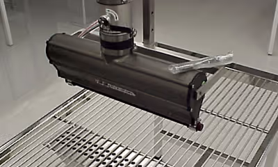 A metal-framed machine with a hose, identified as an ION-AIR Knife for static neutralizing applications.